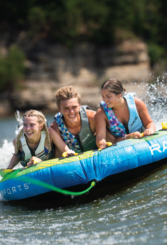 3 tube riders on a RAVE Sports GOAT boat tube