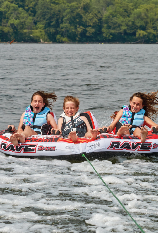 kids riding Warrior III boat towable tube 